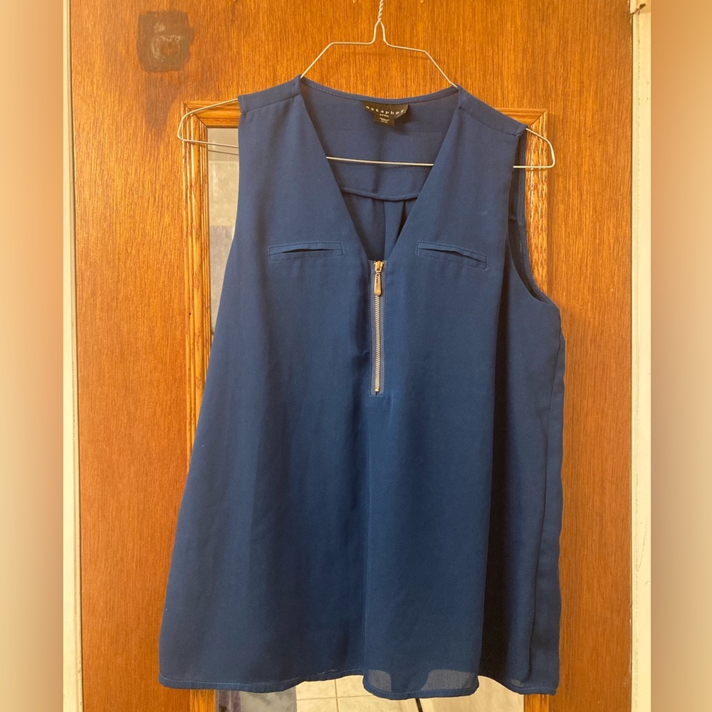 Blue sleeveless shirt with front zipper ($9 cash only)
